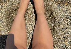 check out this curvy Asian brunette's huge natural tits and soft soles teasing on the beach