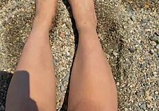 check out this curvy Asian brunette's huge natural tits and soft soles teasing on the beach