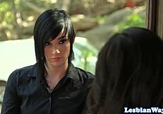 Tattooed dyke babe takes lesbian strapon deep in close-up pussy fuck.