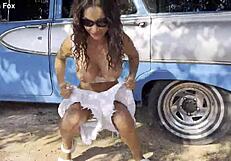 shameless monika fox bares pierced nipples and shaved pussy pissing naked outdoors under tree