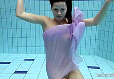 aneta's big tits soak wet in purple dress pool dive