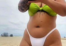 Young African exhibitionist flashes wet pussy at cheese seller on beach
