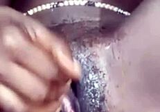 she fingers her smooth shaved wet pussy close up