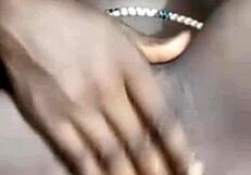 she fingers her smooth shaved wet pussy close up