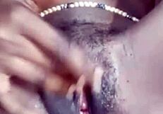she fingers her smooth shaved wet pussy close up