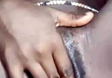 she fingers her smooth shaved wet pussy close up