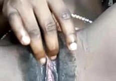 she fingers her smooth shaved wet pussy close up