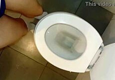 husband dressed as woman pees in bathroom together