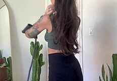 Inked babe stretches with rubber bands in sfw yoga fitness warm-up