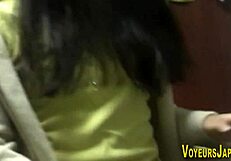 The Asian Babe Masturbates Outdoors in Public While the Voyeur Spies on Her Small Tits