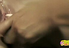 blonde sneaks up on brunette with toy turning fantasy into wet play