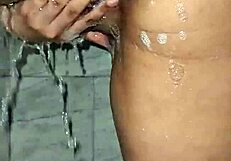 Mature brazilian milf squirts big in shower with monster cock play.