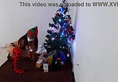 Indian milf masturbates big pussy with dildo by Christmas tree