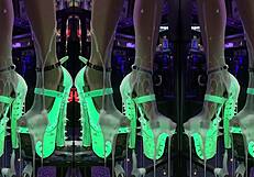 High Heels Dangling Off Counter Legs Spread in Pulsing Nightclub Glow