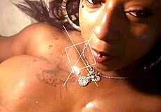 oiled black tits squeezing massive cock in titty fuck rhythm