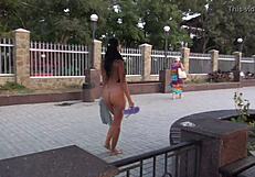 What happens when a naughty milf strips nude for a public street stroll?
