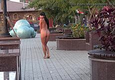 What happens when a naughty milf strips nude for a public street stroll?