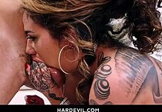 Voluptuous tattooed Arabelle Raphael deepthroats big cocks in blowbang frenzy