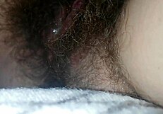 Quick bed masturbation hairy wet pussy close-up big clit vibrates to orgasm
