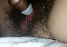 Quick bed masturbation hairy wet pussy close-up big clit vibrates to orgasm