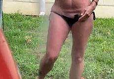 Farmers wife pisses outdoors soaking her plump saggy tits