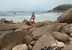 see that big ass african wife shaking her thong outdoors on the beach