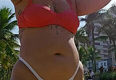 flashing my curves on the beach while filming to tease all the hungry guys