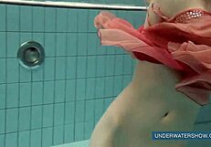 Katya Okuneva tempts in red dress by the pool