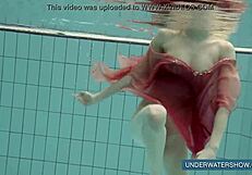 Katya Okuneva tempts in red dress by the pool
