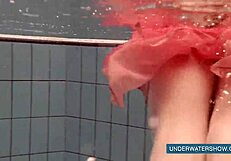 Katya Okuneva tempts in red dress by the pool