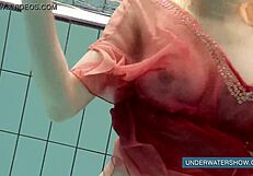 Katya Okuneva tempts in red dress by the pool