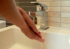 brunette eveline fingers herself in the bathroom