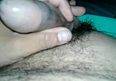 A guy pulls condom over his small cock for solo play