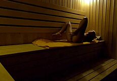 whoa, hidden cam catches this teen fingering wet in sauna 😏