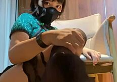 Under the mahjong table, her black stockings tease with dirty footjob talk.