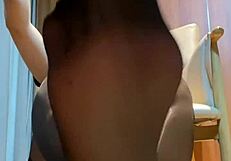Under the mahjong table, her black stockings tease with dirty footjob talk.