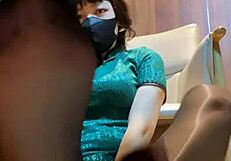 Under the mahjong table, her black stockings tease with dirty footjob talk.