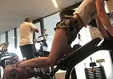 Sweaty gym babe teases her fit body during steamy workout session