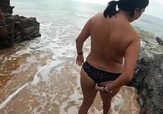 Curvy Spanish milf bends over for public beach cock pounding