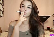 xo bunny's blue eyed brunette latina face smokes cigarette blows in your face while femdom slave titjob