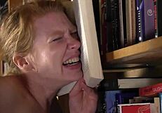 In the library, Madison Young takes Beretta James' strapon deep and hard