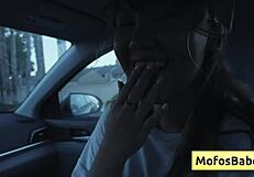 Sexy asian hottie plays with big boobs in car