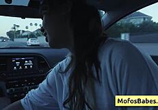 Sexy asian hottie plays with big boobs in car
