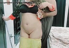 The pakistani housewife prepares dinner for her husband at home