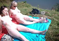 Mature Mommy And Young 18+ Girl Sunbathe Naked On Beach