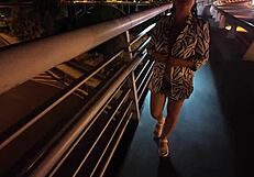 Luscious milf walks without a bra and panties on the bridge