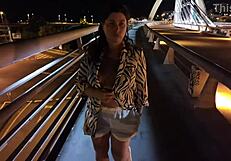 Luscious milf walks without a bra and panties on the bridge