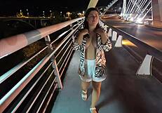 Luscious milf walks without a bra and panties on the bridge