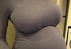 the pregnant stepmother pulls her milky tits out of her red bra