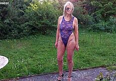 Martina Displays Natural Tits In Shiny Blue Lace Body Outdoors